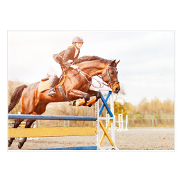 Plakat Podpalany koń z dziewczyną skaczący nad przeszkodą 