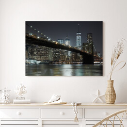 Obraz na płótnie Widok na Most Brooklyński na tle panoramy oświetlonego Nowego Jorku nocą