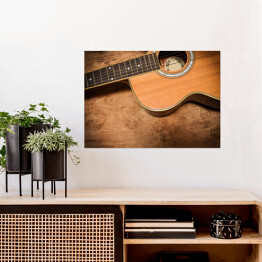 Plakat Gitara akustyczna na tle imiującym nieociosane drewno