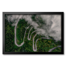 Obraz w ramie Droga wijąca się wśród mglistych wzgórz w Rumunii o poranku