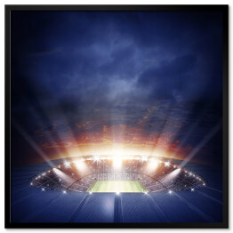 Plakat w ramie Oświetlony stadion pod granatowym niebem