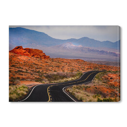 Obraz na płótnie Otwarta droga w czerwonym skalistym pustynnym terenie 