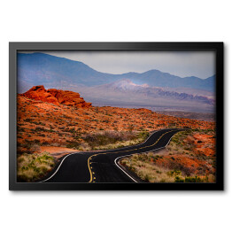 Obraz w ramie Otwarta droga w czerwonym skalistym pustynnym terenie 