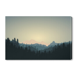 Obraz na płótnie Ciemny las na tle gór w trakcie wschodu słonca