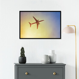 Plakat w ramie Samolot przecinający promienie słońca