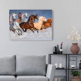 Obraz na płótnie Stado koni galopujących w zimie